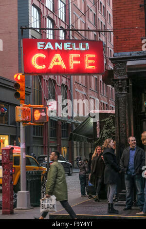 Crowded Sidewalk Outside Fanelli Cafe neon sign, SoHo, NYC Stock Photo