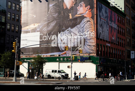 Day time view of a very large Calvin Klein Jeans advertising billboard on building facade in downtown New York City, USA Stock Photo
