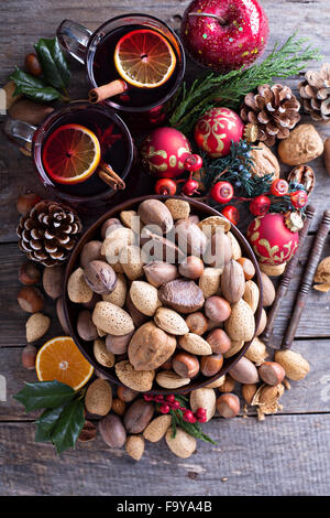 Variety of nuts with shells in a brown bowl Stock Photo