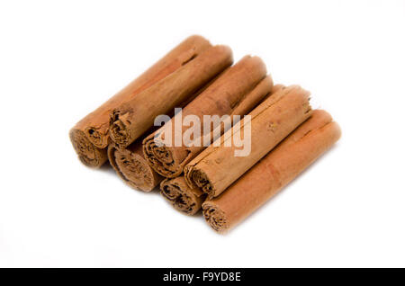 Cinnamon sticks arranged on a white background Stock Photo