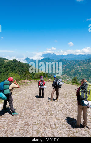 Group of people with backpacks taking a picture and hiking the mountain Tajamulco on pathway Stock Photo