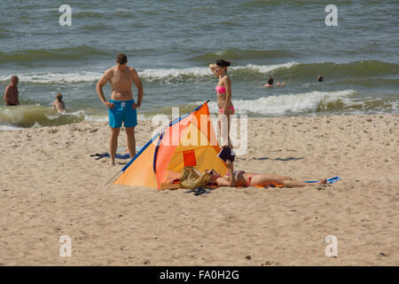 PALANGA, LITHUANIA - AUGUST 02: Affluence of holidaymakers to Palanga beach on August 02, 2015 in Palanga, Lithuania. About 1 mi Stock Photo