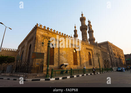 People and police walking around the buildings of Al Azhar Mosque and Madrasa, an important university for Sunni Islamic studies Stock Photo