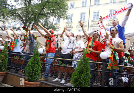 LVIV, UKRAINE - JUNE 9, 2012: Portugal football team supporters walk on a streets of Lviv city before UEFA EURO 2012 game agains Stock Photo