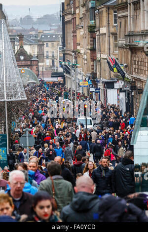 Glasgow, UK. 19th Dec, 2015. Encouraged by the unseasonably high temperatures and mild weather, thousands of Christmas shoppers collected in Glasgow's Style Mile, better known as Buchanan Street, to do some last minute Christmas shopping. The last Saturday before Christmas has now been dubbed 'Panic Saturday'. To add to the festive spirit, The Salvation Army played Christmas Carols to passers-by and collected donations for charity. Credit:  Findlay/Alamy Live News Stock Photo