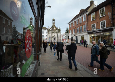 Christmas shoppers in East Street, Chichester, West Sussex, England do some last minute shopping on the last Saturday before Christmas day. Stock Photo