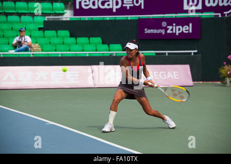 Professional women's tennis player, Kimiko Date-Krumm returns a double handed backhand at the Stock Photo