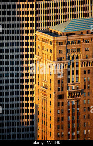 Aerial view of Neo-gothic Lincoln Building at sunset contrasts with Modernist skyscraper in Midtown Manhattan, New York City Stock Photo