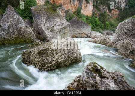 Boulders and fast flowing water Gorges du Tarn France Stock Photo