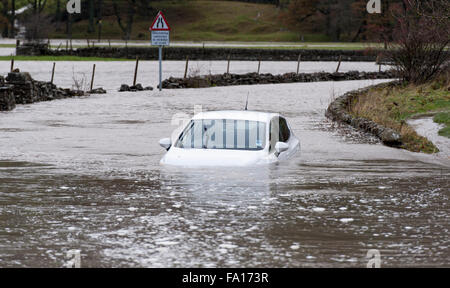 A car caught up in the flooding around Hawes, Wensleydale in North Yorkshire. The second time flooding has hit the are in the pa Stock Photo