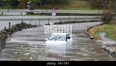 A car caught up in the flooding around Hawes, Wensleydale in North Yorkshire. The second time flooding has hit the are in the pa Stock Photo