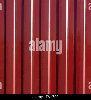 Diagonal pattern of metal profile. Fences from the galvanized iron painted by a polymeric covering. Stock Photo