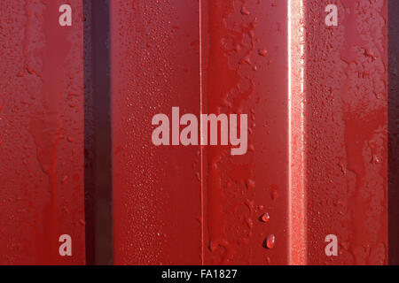 Diagonal pattern of metal profile. Fences from the galvanized iron painted by a polymeric covering. Stock Photo