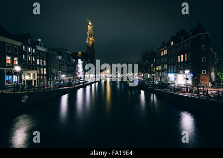 The Prinsengracht canal and Westerkerk at night, in Amsterdam, The Netherlands. Stock Photo