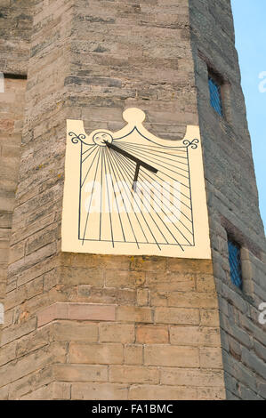 Medieval sundial on stone castle tower UK England Stock Photo