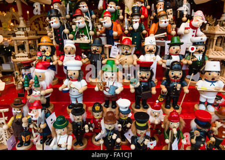 Christmas market on the square near the Kaiser Wilhelm Memorial Church. Souvenirs and gifts. Little wooden man. Stock Photo