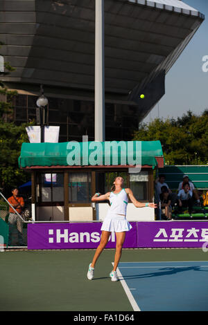 Professional women's tennis player, Magdalena Rybarikova tracks a thrown ball while serving at the Hansol Korea Open Stock Photo