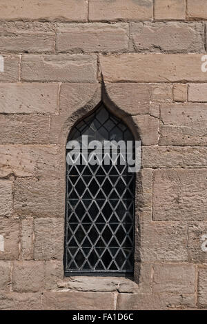 Single medieval castle stained glass window detail close up view Stock Photo