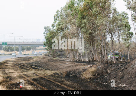 EPPING, AUSTRALIA - 20 DECEMBER 2015: A day after fires swept through Epping in Melbourne, CFA Fire Crews patrol the area for spot fires as Melbourne Suffered it's hottest day in December hitting 45 degrees C. Stock Photo