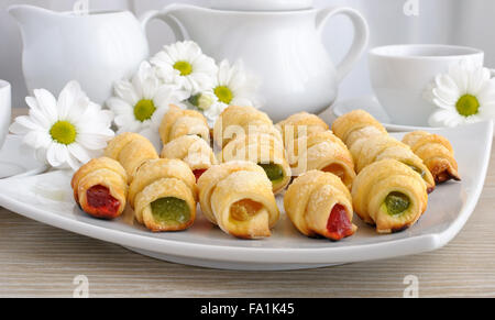 Plate with homemade croissants filled with colorful jelly Stock Photo