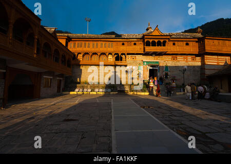 Indian tourists meeting in a temple shadow at the inner courtyard of the Bhimakali Temple Stock Photo