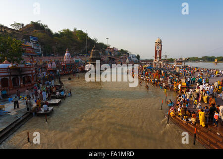 Hindus gather and taking a ritual cleansing bath in the Ganges River for purification Stock Photo
