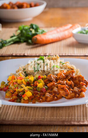 Sweet and sour chicken and rice with vegetables Stock Photo