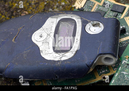 A pile of broken pieces of mobile phones and phone batteries Stock Photo