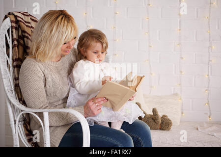 Mother reading to her daughter Stock Photo