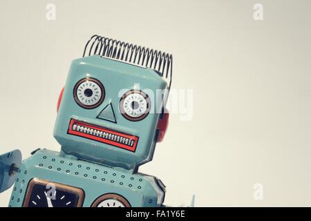 Vintage tin toy robot isolated on white background, filtered retro photo Stock Photo