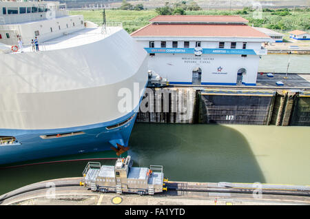 Automobile Transporter Ship and Tug in Miraflores Locks, Panama Canal Stock Photo