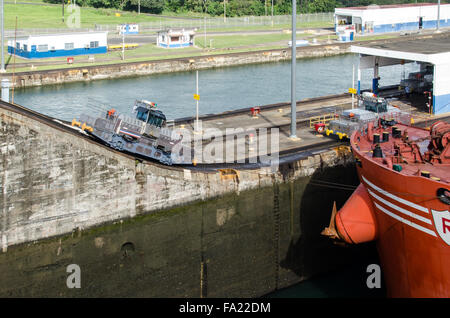 Electric Locomotive, Mule, and Ship at Gatun Locks, Panama Canal, Panama Stock Photo