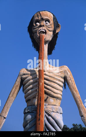 Giant Sculpture of Male Sinner. Kitsch Folk Art Sculpture in the Wat Wang Saen Suk Hell Garden in the Temple Grounds, Bang Saen, Chonburi Thailand Stock Photo