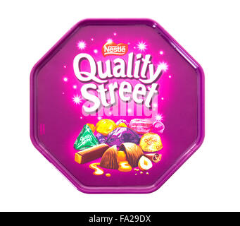 Tin of Quality Street Chocolates Isolated On White Background. A popular selection of individual sweets Stock Photo