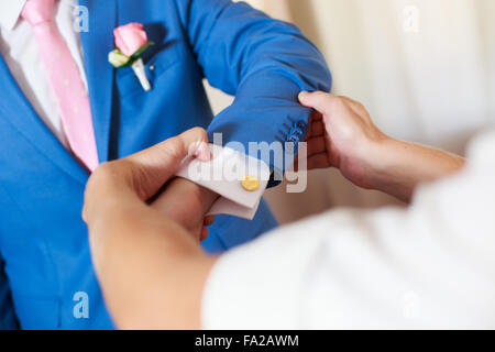 Clopse up picture of a groom getting ready Stock Photo