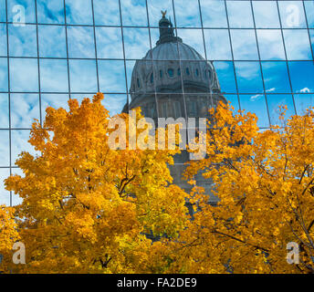 IDAHO STATE CAPITOL Dome reflecting in the Hall of Mirrors bordered by Autumn Trees. Boise, Idaho, USA Stock Photo