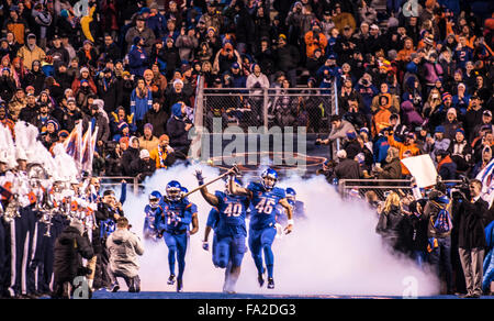 Football, Boise State football team entering Albertson's Stadium blue field through fog cloud before game time. Boise, Idaho, Stock Photo