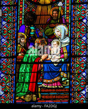 Stained glass window depicting the Three Wise Men visiting Jesus, in the abbey of Santa Maria de Montserrat in Catalonia, Spain Stock Photo