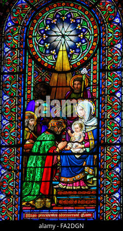 Stained glass window depicting the Three Wise Men visiting Jesus, in the abbey of Santa Maria de Montserrat in Catalonia, Spain Stock Photo