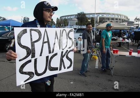 Dec. 20, 2015 - DIEGO, December 20, 2015, San Diego, CA | Chargers fan Andy Garcia of Chula Vista carries a sign saying how feels the Chargers' ownership as he walks past fellow Chargers fans, who here to see the Chargers play Miami, before the Chargers last home game, possibly last home game ever if Chargers move, at Qualcomm Stadium in San Diego on Sunday. | Photo by Hayne Palmour IV/San Diego Union-Tribune/Mandatory Credit: HAYNE PALMOUR IV/SAN DIEGO UNION-TRIBUNE/ZUMA PRESS San Diego Union-Tribune Photo by Hayne Palmour IV copyright 2015 (Credit Image: © Hayne Palmour Iv/U-T San Diego via Stock Photo