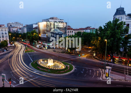 Madrid Spain,Hispanic Centro,Chamberi,Plaza Alonzo Martinez,dusk,night evening,time exposure,traffic circle,fountain,lighted,Spain150706103 Stock Photo