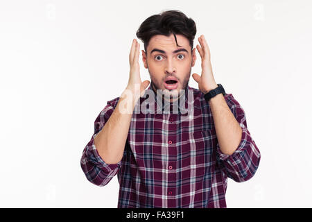 Portrait of a shocked man looking at camera isolated on a white background Stock Photo