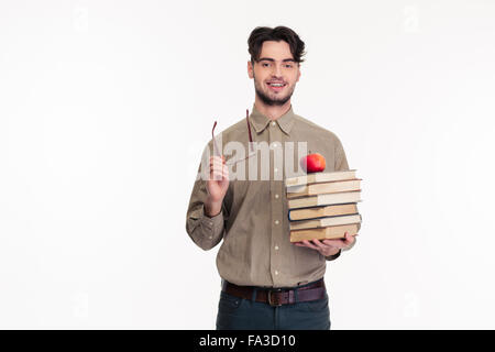 Portrait of a casual man holding glasses and books isolated on a white background Stock Photo
