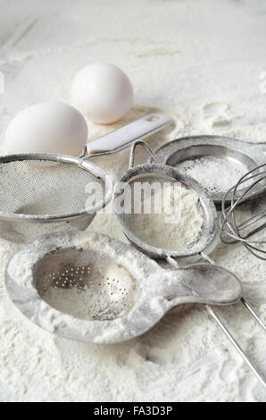 Kitchen utensils and wheat flour on the table Stock Photo