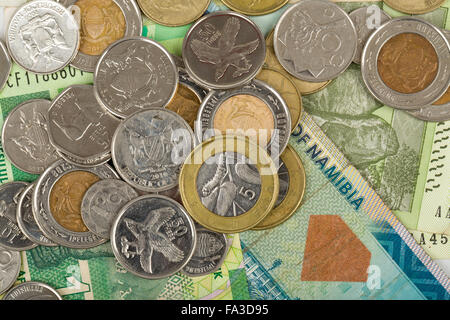 South african countries banknotes and coins for background. Botswana pula, Namibian dollar, South Africa rand and Zimbabwe dolla Stock Photo