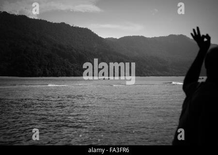 West Papua. 29th May, 2015. OPM commanders flank each other on the sea as an sign of safety. Indonesian navy vessels regularly patrol the coastal areas as part of their counter insurgency programmes. © Rohan Radheya/ZUMA Wire/Alamy Live News Stock Photo