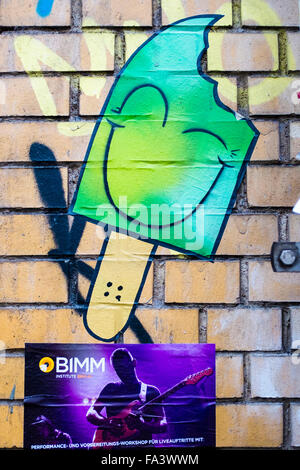Berlin street art and graffiti - Green Ice lolly with bite mark and smiling face Stock Photo