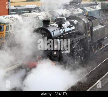 Steam locomotive, 76084,  (a Standard 4 class) in Weybourne station, North Norfolk Railway, Norfolk, England, UK. Stock Photo