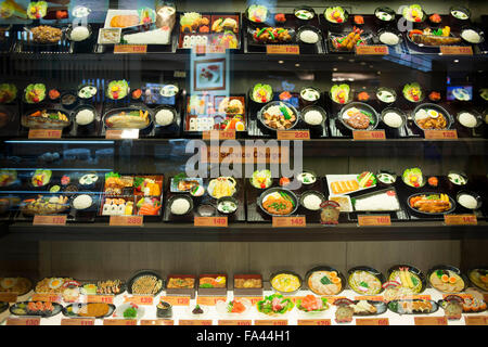 Fast food thai restaurant in Bangkok. Showcase with fake food and prices in a mall restaurant. Stock Photo