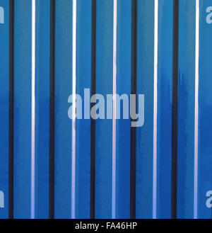 Diagonal pattern of metal profile. Fences from the galvanized iron painted by a polymeric covering. Stock Photo